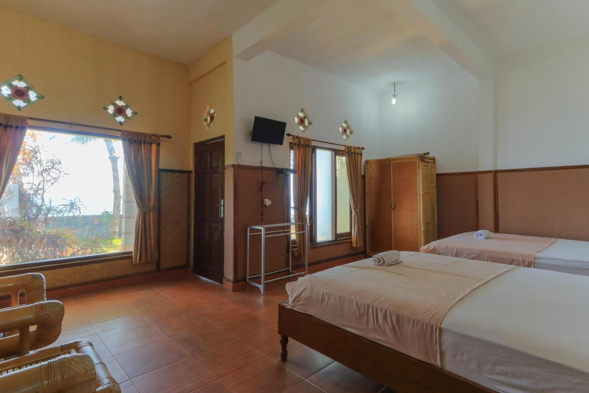 Hotel Tara Bar & Resto Air Sanih Кубутамбахан Номер фото